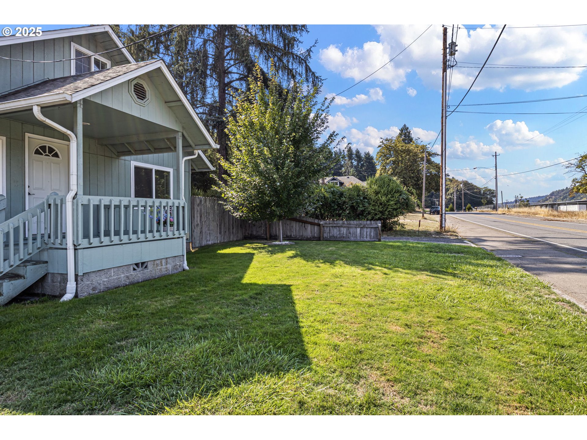 405 Lane Avenue Drain, OR 97435 - Photo 6 of 47 a view of a house with a yard and deck