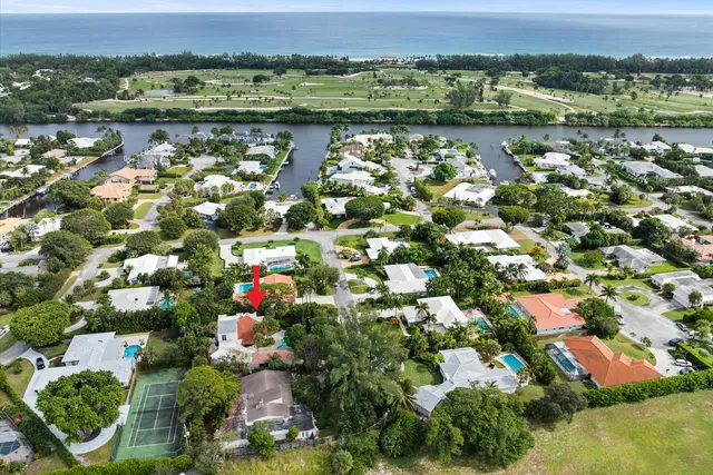 an aerial view of a residential houses and outdoor space