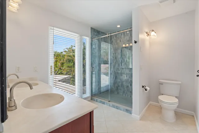 a bedroom with furniture and a flat screen tv