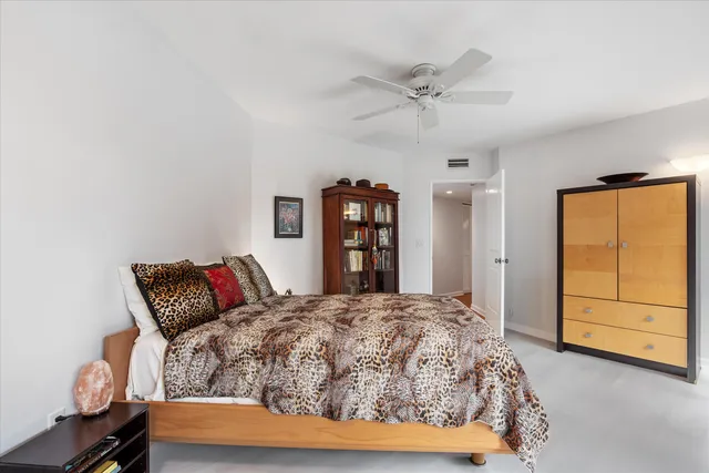 a spacious bathroom with a granite countertop sink mirror and window