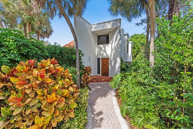 front view of a house with a small yard