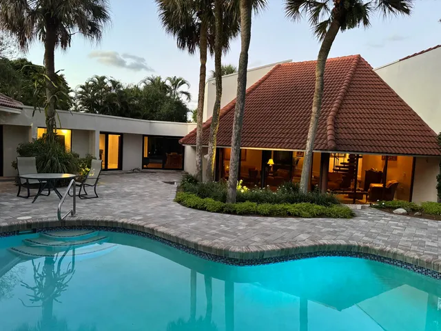 an aerial view of a house with a lake view