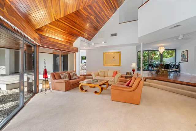 a view of a dining room with furniture wooden floor and chandelier