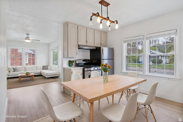 141 South 400 East Logan, UT 84321 - Photo 9 of 41 Dining room featuring light wood-style floors -Virtually Staged