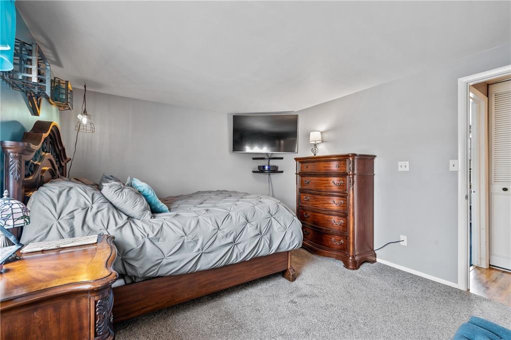 1885 George Circle Irwin, PA 15642 - Photo 12 of 25 a bedroom with a bed and a television