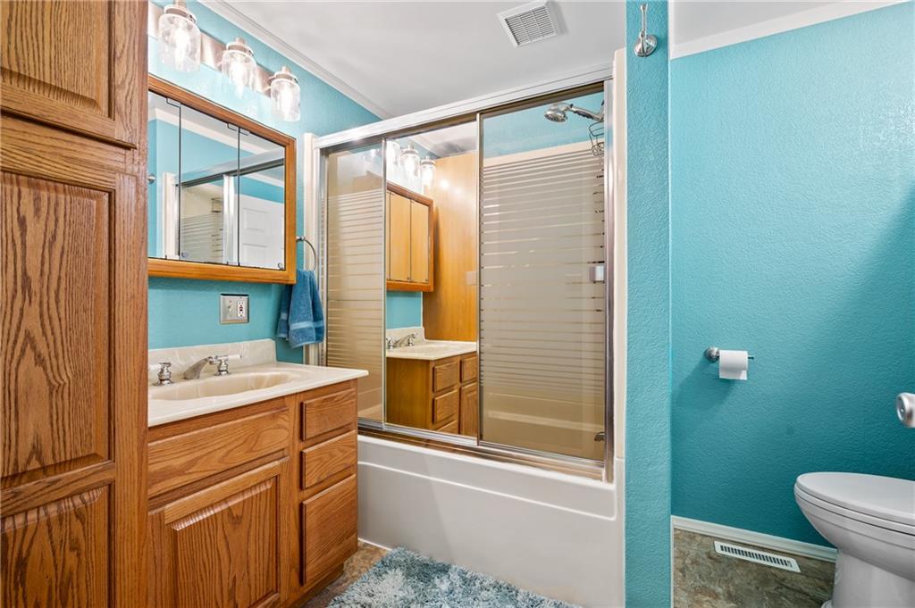 1885 George Circle Irwin, PA 15642 - Photo 17 of 25 a bathroom with a sink a toilet and shower