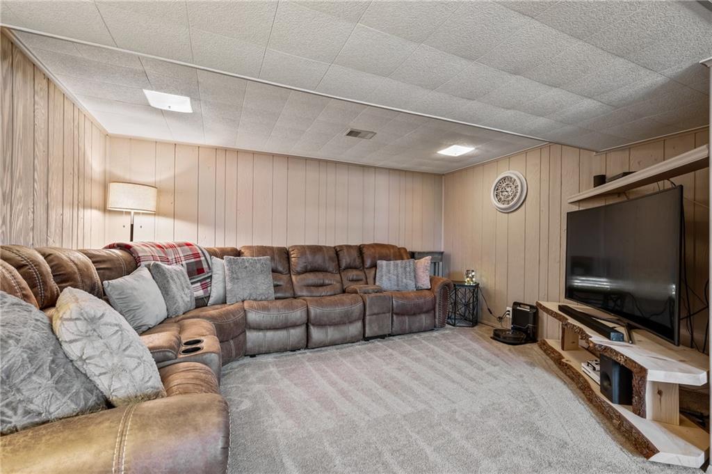 1885 George Circle Irwin, PA 15642 - Photo 20 of 25 a living room with furniture and a flat screen tv