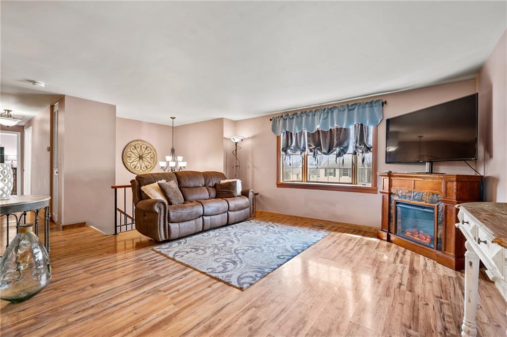 1885 George Circle Irwin, PA 15642 - Photo 2 of 25 a living room with furniture and a flat screen tv