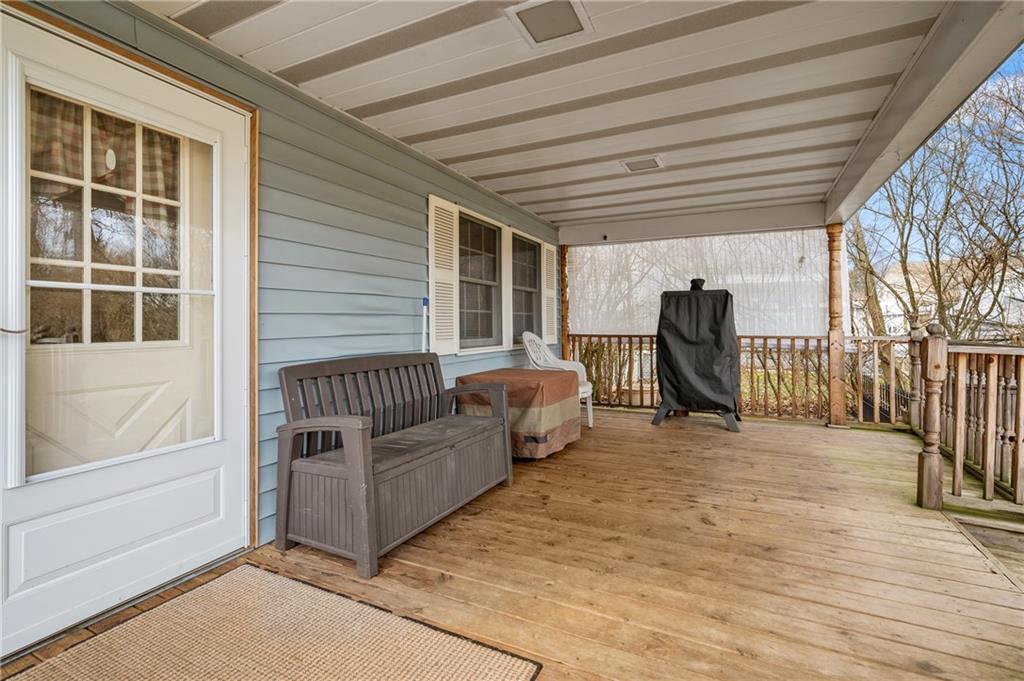 1885 George Circle Irwin, PA 15642 - Photo 22 of 25 a view of a porch with furniture and a yard