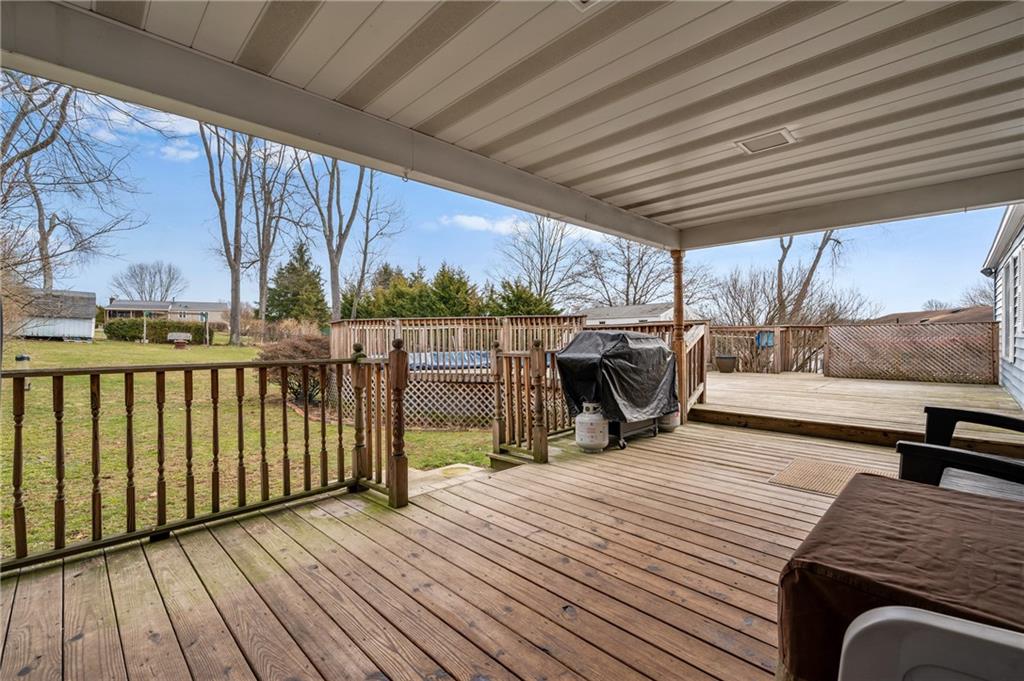 1885 George Circle Irwin, PA 15642 - Photo 23 of 25 a view of a balcony with chairs and wooden floor