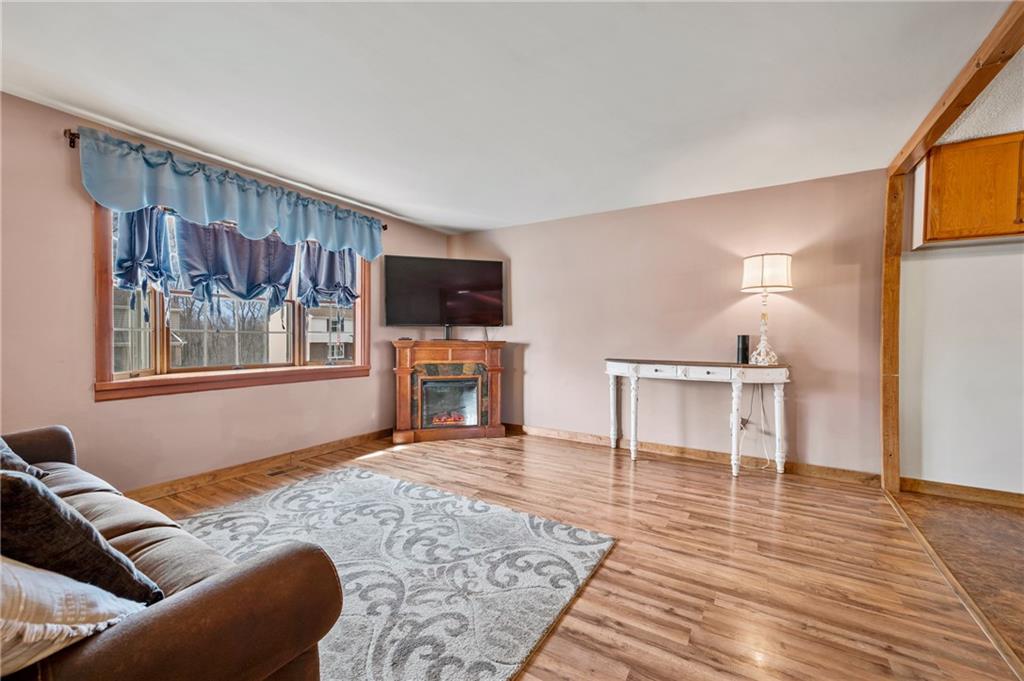 1885 George Circle Irwin, PA 15642 - Photo 3 of 25 a living room with furniture and a fireplace