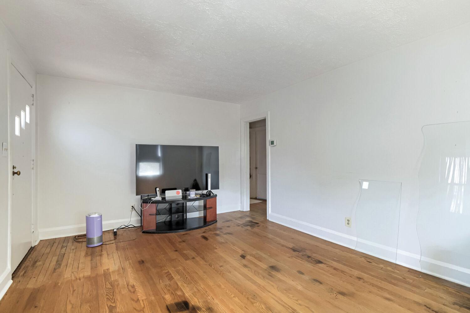 217 Doris Avenue Baltimore, MD 21225 - Photo 6 of 16 a bedroom with a bed and window