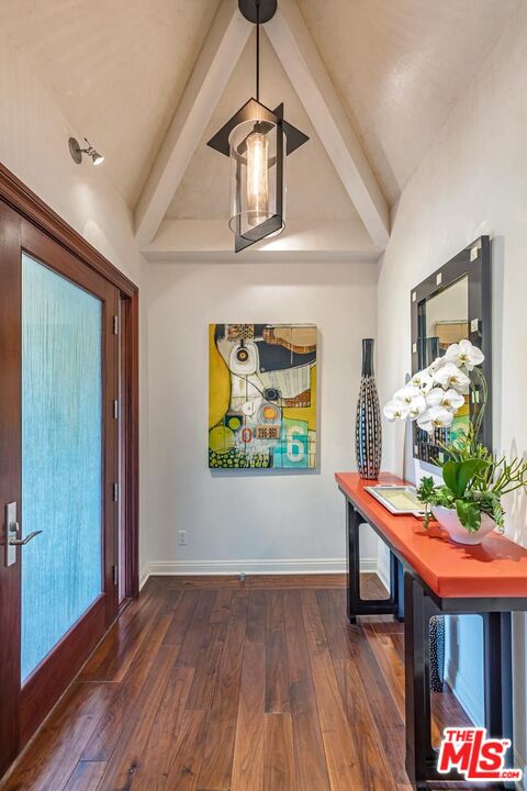 23416 Malibu Colony Road Malibu, CA 90265 - Photo 6 of 26 a dining room with furniture potted plants and wooden floor