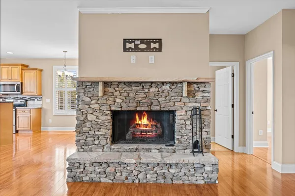 a view of a living room with a fireplace