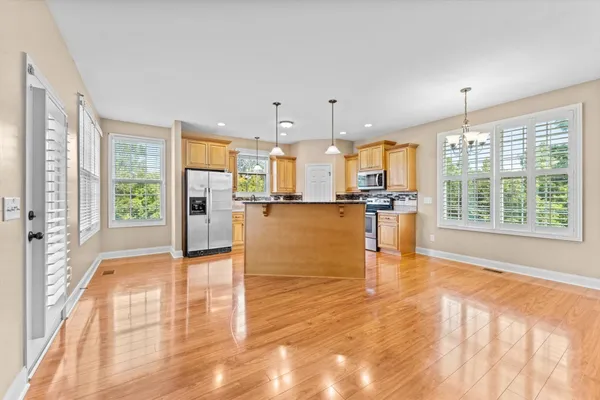 a view of large kitchen with large windows