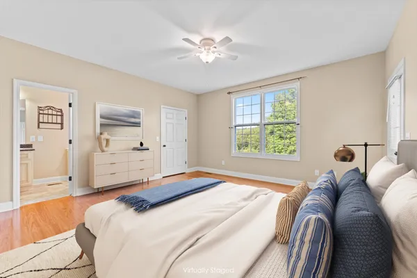 a bedroom with a large bed and closet