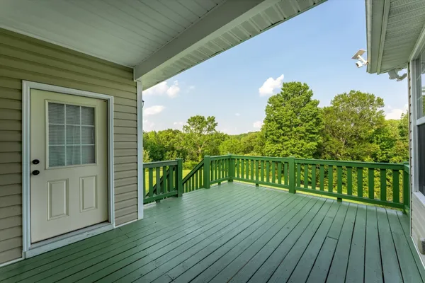 a balcony with wooden floor