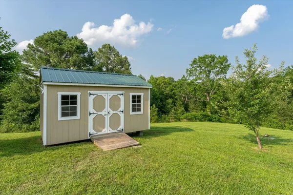 a house view with a garden space