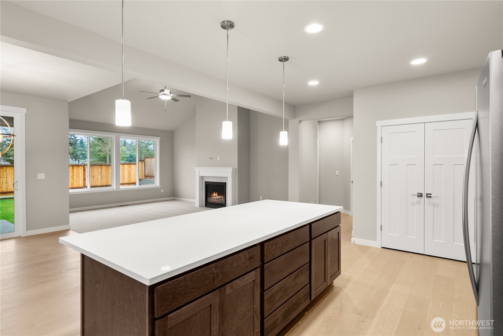 715 Maggee Street Southeast Lacey, WA 98513 - Photo 12 of 35 a large white kitchen with a sink a refrigerator and a stove top oven