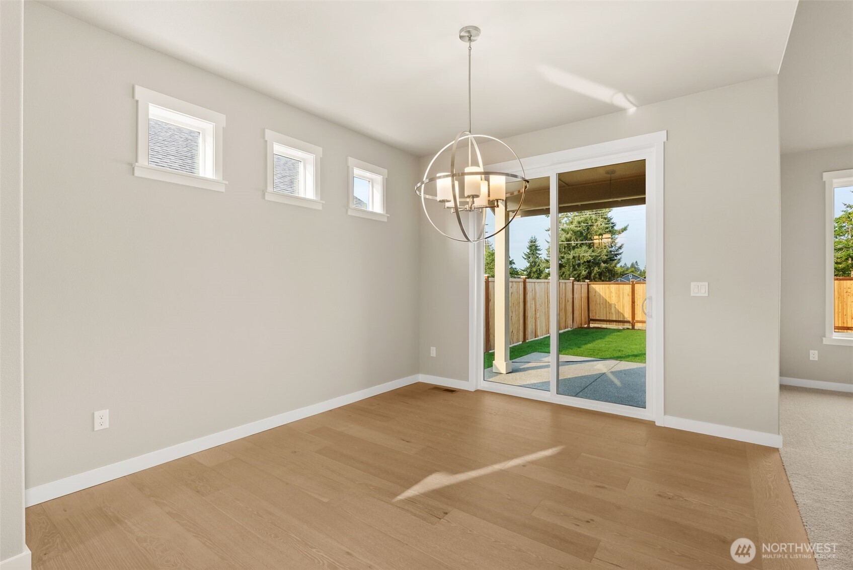 715 Maggee Street Southeast Lacey, WA 98513 - Photo 13 of 35 a view of empty room with wooden floor and fan