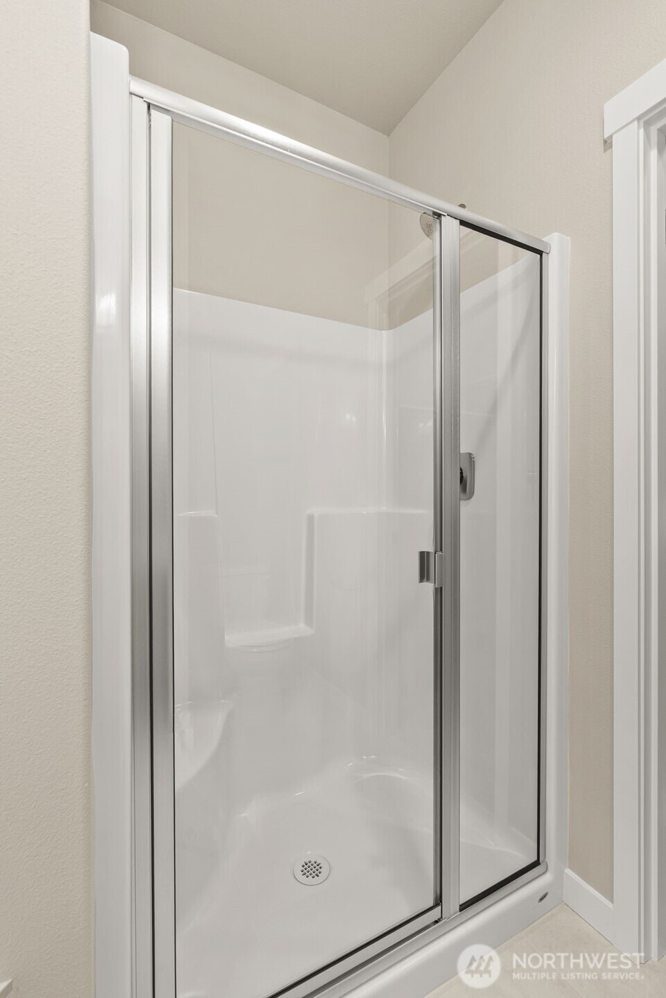 715 Maggee Street Southeast Lacey, WA 98513 - Photo 17 of 35 a bathroom with a glass shower door
