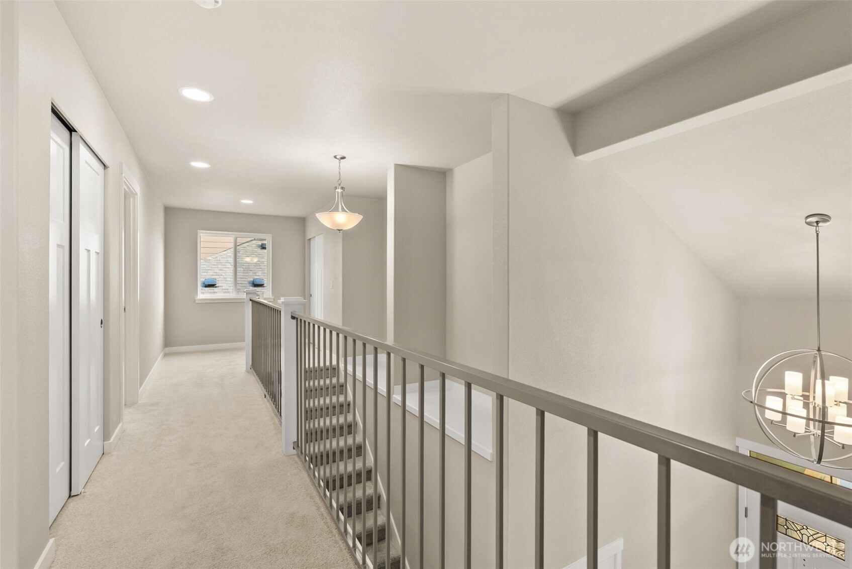 715 Maggee Street Southeast Lacey, WA 98513 - Photo 22 of 35 a view of a hallway with wooden floor and a bathroom