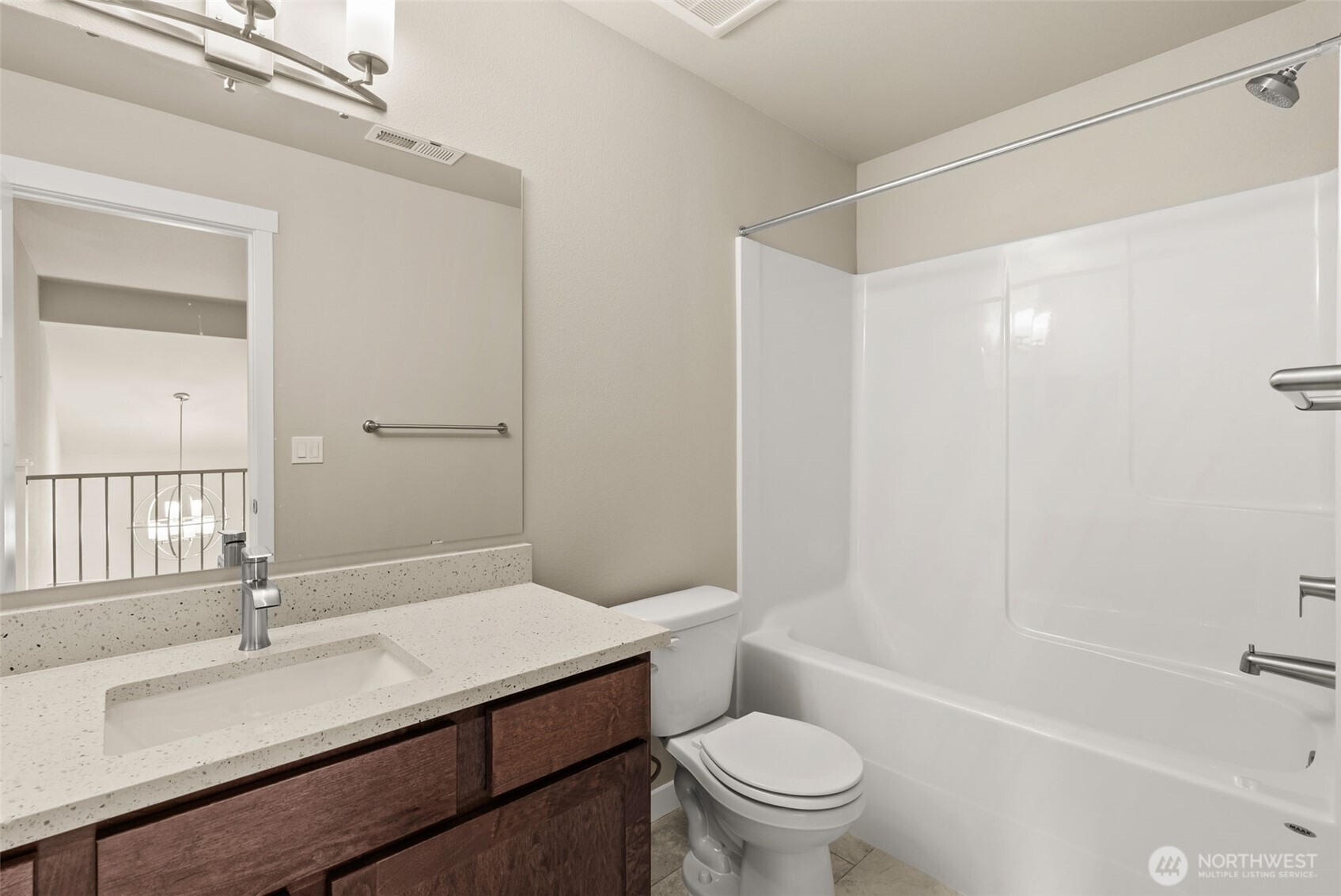 715 Maggee Street Southeast Lacey, WA 98513 - Photo 24 of 35 a bathroom with a granite countertop sink a toilet and shower