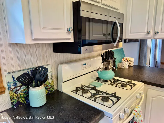 a kitchen with a stove and a microwave