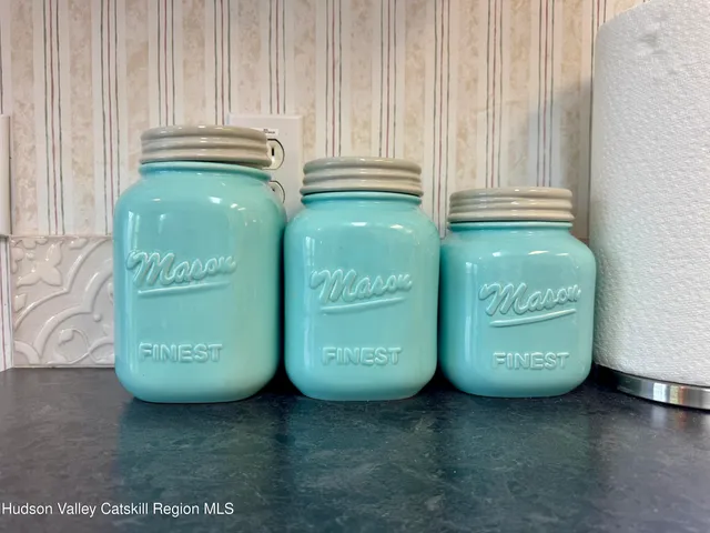 a kitchen with stainless steel appliances granite countertop a sink and a window