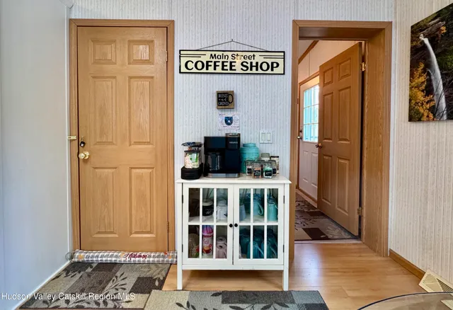 a kitchen with a refrigerator and a stove