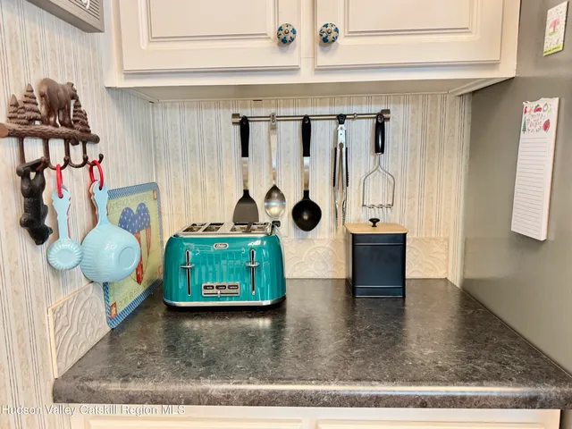 a view of a bedroom with washer and dryer