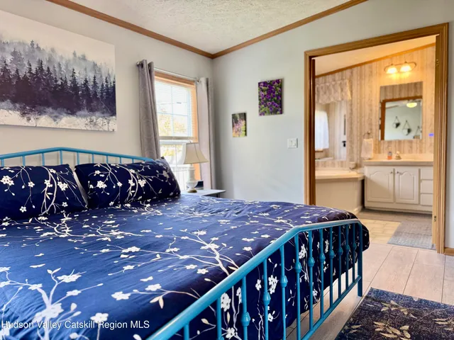 a bathroom with a double vanity sink toilet and a mirror
