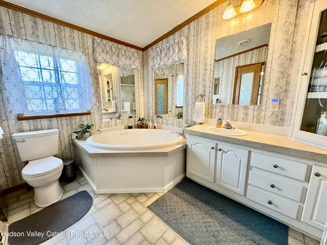 a bathroom with a double vanity sink and mirror