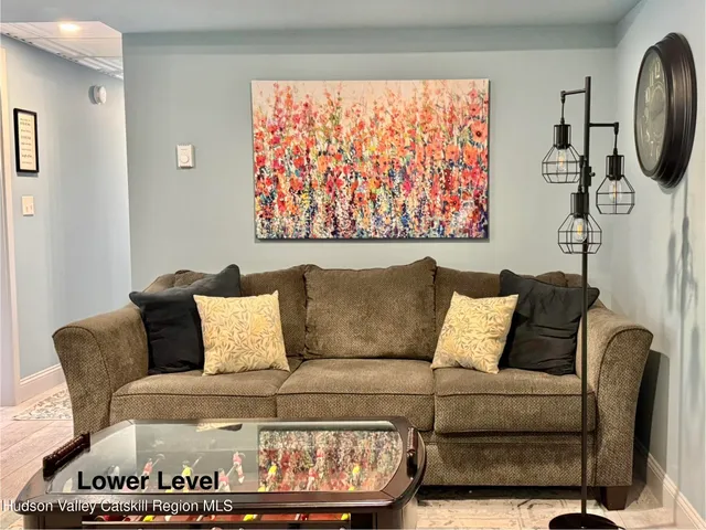 a living room with furniture and a rug