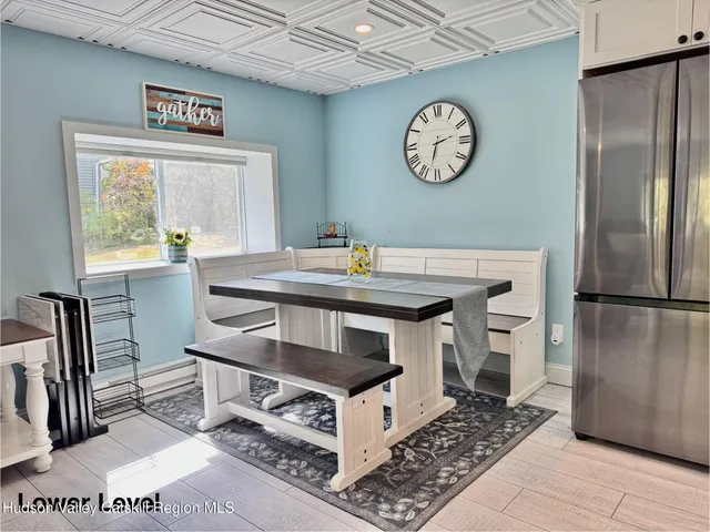 a view of balcony with furniture and wooden floor