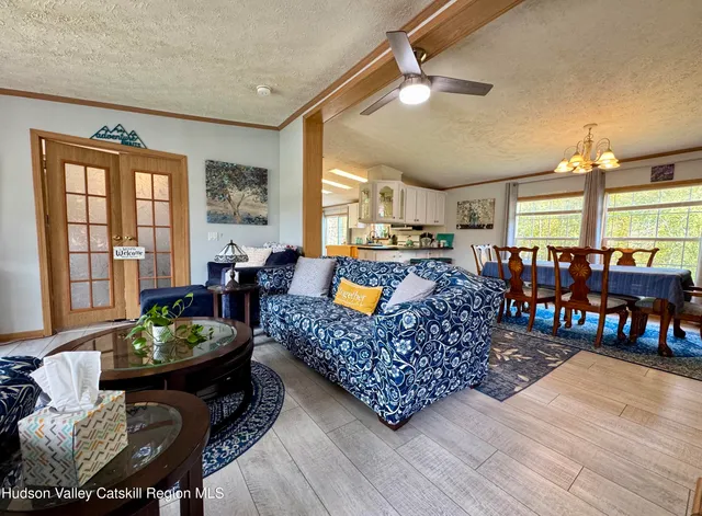 a living room with lots of furniture and a table