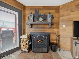 407 South Vasels Road, Unit 49 Brian Head, UT 84719 - Photo 9 of 40 Detailed view of wooden walls and a warm lit fireplace