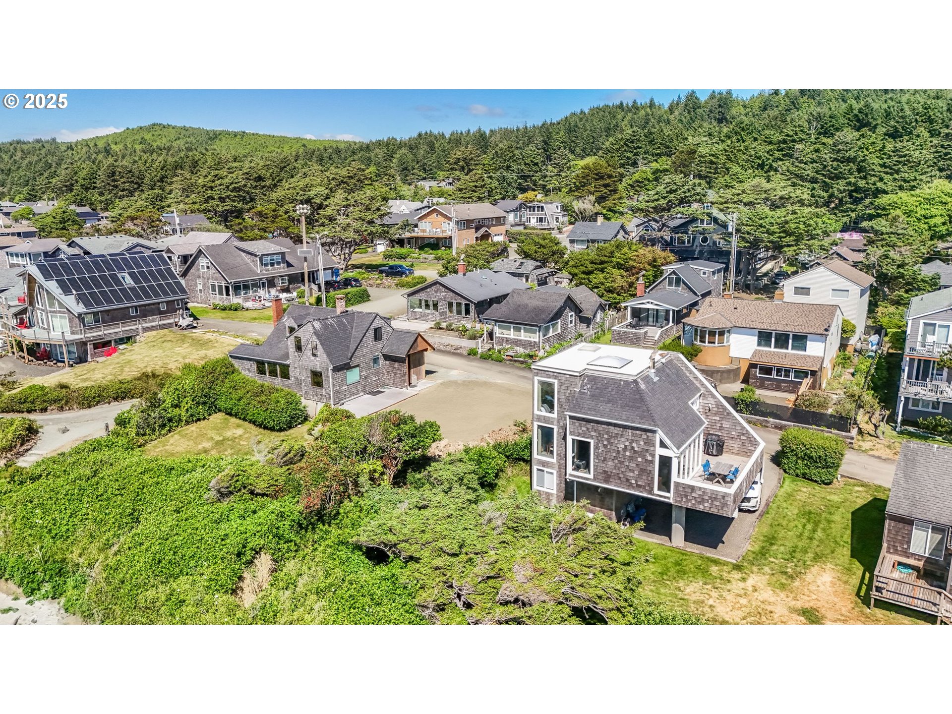 Ocean Avenue Cannon Beach, OR 97110 - Photo 9 of 12 a view of a house with a garden space