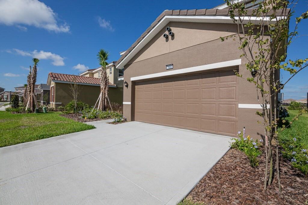 7683 Oakmoss Loop Davenport, FL 33837 - Photo 2 of 64