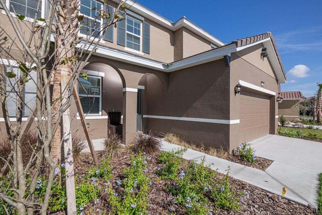 7683 Oakmoss Loop Davenport, FL 33837 - Photo 3 of 64