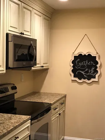 a kitchen with a stove and a microwave