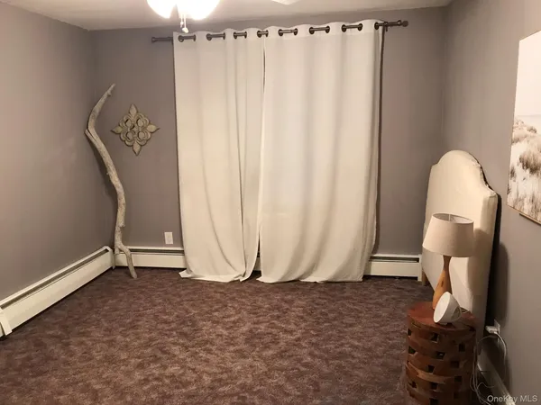 a view of a room with swing and furniture