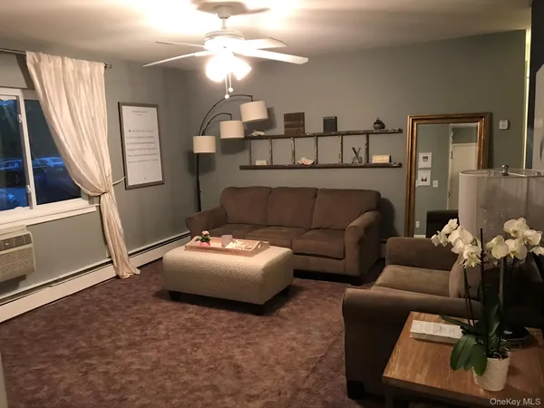 a bedroom with furniture and wooden floor