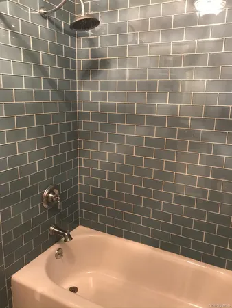 a white toilet sitting next to a bathroom sink
