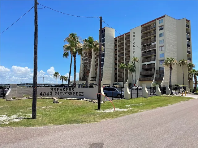 a view of a building with a yard