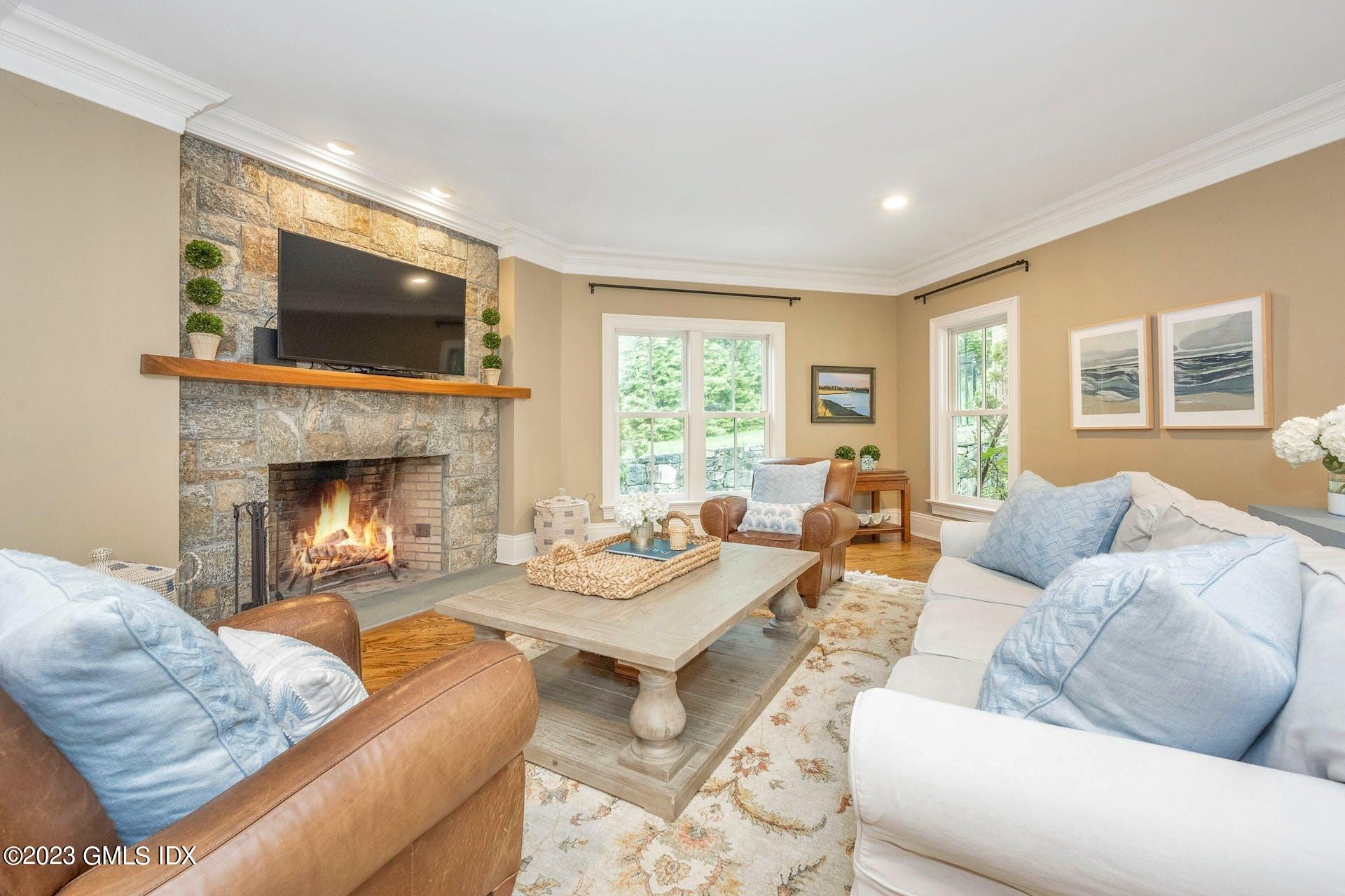 53 Hillside Road Greenwich, CT 06830 - Photo 11 of 37 a living room with furniture and a fireplace