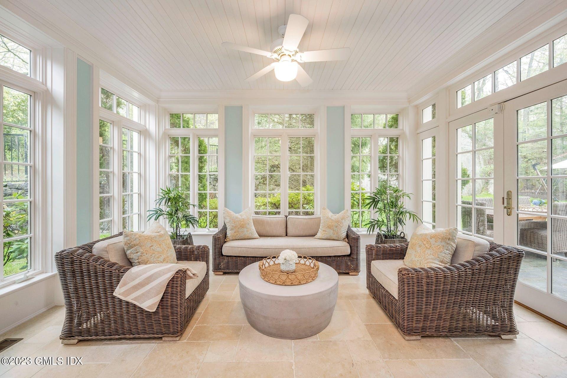 53 Hillside Road Greenwich, CT 06830 - Photo 12 of 37 a living room with furniture and floor to ceiling windows