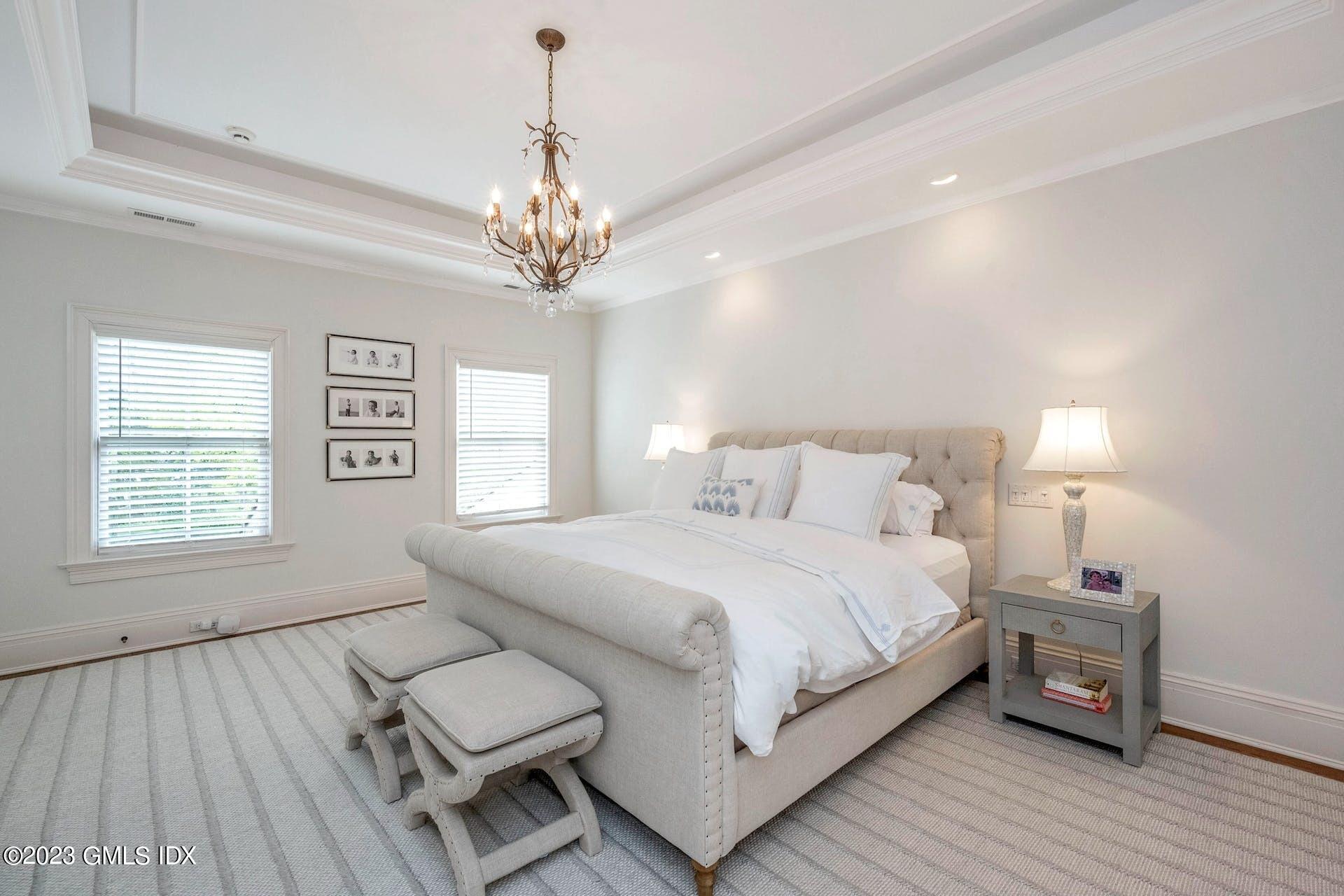 53 Hillside Road Greenwich, CT 06830 - Photo 16 of 37 a spacious bedroom with a bed and a window