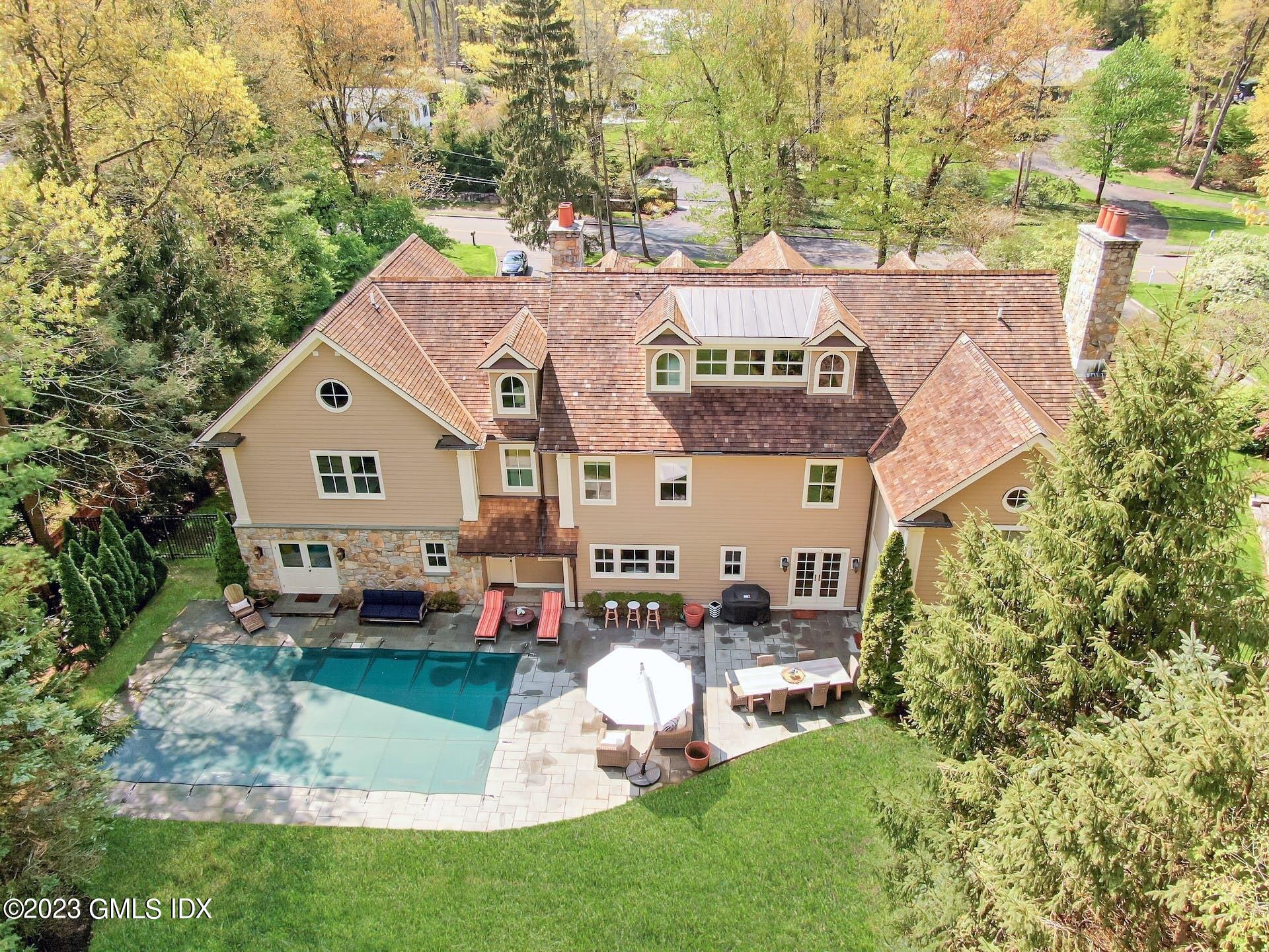 53 Hillside Road Greenwich, CT 06830 - Photo 32 of 37 a view of a house with a yard and sitting area