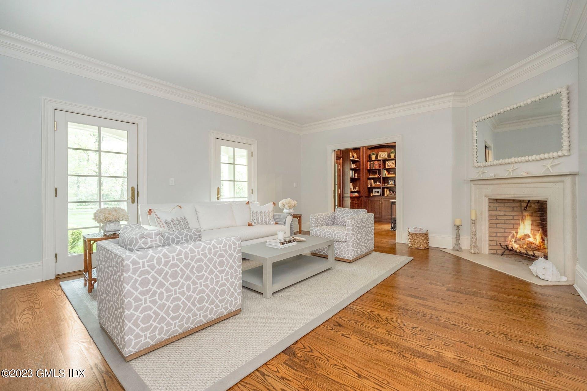 53 Hillside Road Greenwich, CT 06830 - Photo 6 of 37 a living room with furniture and a fireplace